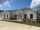 Ranch style home with gray siding, stone accents, and a covered porch at 3908 Shelleydale Dr, Powder Springs, GA 30127