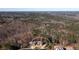 Aerial view of the home nestled within a wooded neighborhood, circled at 1560 Tapestry Rdg, Lawrenceville, GA 30045