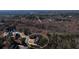 Elevated aerial view showcasing the community and surrounding wooded area, circled at 1560 Tapestry Rdg, Lawrenceville, GA 30045