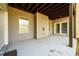 Covered concrete back patio, perfect for grilling and outdoor activities at 1560 Tapestry Rdg, Lawrenceville, GA 30045