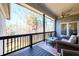 Spacious back porch with wooded views, perfect for outdoor entertaining at 1560 Tapestry Rdg, Lawrenceville, GA 30045