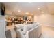 Large basement living room with sectional sofa, fireplace, and game area at 1560 Tapestry Rdg, Lawrenceville, GA 30045