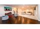 Finished basement with hardwood floors, sectional sofa, and entertainment area at 1560 Tapestry Rdg, Lawrenceville, GA 30045