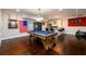 Basement game room featuring pool table, bar, and college banners at 1560 Tapestry Rdg, Lawrenceville, GA 30045