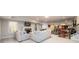Open concept basement with carpeted living area, fireplace, and game room at 1560 Tapestry Rdg, Lawrenceville, GA 30045