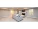 Spacious basement living area with plush carpeting, sectional sofa, and fireplace at 1560 Tapestry Rdg, Lawrenceville, GA 30045