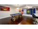 Finished basement with a pool table, bar, and wall-mounted TV at 1560 Tapestry Rdg, Lawrenceville, GA 30045