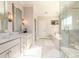 Elegant bathroom featuring dual vanities, a soaking tub, and glass shower at 1560 Tapestry Rdg, Lawrenceville, GA 30045