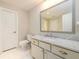 Simple bathroom design with marble countertop, white cabinetry, and a toilet at 1560 Tapestry Rdg, Lawrenceville, GA 30045