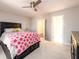 Comfortable bedroom with carpeted floors, dark wood furniture, and a view to hallway at 1560 Tapestry Rdg, Lawrenceville, GA 30045