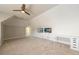 Versatile bonus room featuring two wall-mounted TVs and a workspace area at 1560 Tapestry Rdg, Lawrenceville, GA 30045