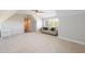 Large bonus room with carpeted floors, high ceilings, and plenty of space for activities at 1560 Tapestry Rdg, Lawrenceville, GA 30045