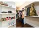 Organized walk-in closet with plenty of shelving and hanging space at 1560 Tapestry Rdg, Lawrenceville, GA 30045