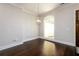 Empty dining room with hardwood floors, large window, and neutral paint, ready for your design at 1560 Tapestry Rdg, Lawrenceville, GA 30045