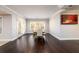 Basement dining area with dark hardwood floors, table, and outdoor access at 1560 Tapestry Rdg, Lawrenceville, GA 30045