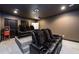 Dedicated home theater room with black leather recliner chairs at 1560 Tapestry Rdg, Lawrenceville, GA 30045