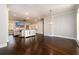 Open concept living room and dining area with dark wood floors at 1560 Tapestry Rdg, Lawrenceville, GA 30045