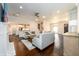 Open living room with hardwood floors, a fireplace, and comfortable seating at 1560 Tapestry Rdg, Lawrenceville, GA 30045