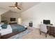 Spacious main bedroom with a cozy bed, workspace area, and vaulted ceiling at 1560 Tapestry Rdg, Lawrenceville, GA 30045