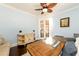 Cozy office space with blue walls, a ceiling fan, and French doors at 1560 Tapestry Rdg, Lawrenceville, GA 30045
