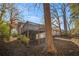Elevated deck overlooks wooded backyard with large trees at 2496 Montezuma Cir, Ellenwood, GA 30294