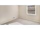 Simple bedroom with carpet, neutral walls, and large window at 2496 Montezuma Cir, Ellenwood, GA 30294