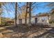 Ranch house exterior with large trees and wooded backyard at 2496 Montezuma Cir, Ellenwood, GA 30294