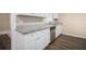 Updated kitchen with white cabinets, granite countertops and stainless steel appliances at 2496 Montezuma Cir, Ellenwood, GA 30294
