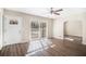 Bright living room featuring hardwood floors and a ceiling fan at 2496 Montezuma Cir, Ellenwood, GA 30294