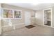 Sunroom with carpet, exterior access, and built-in shelving at 2496 Montezuma Cir, Ellenwood, GA 30294
