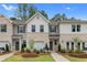 Luxury townhome boasting curb appeal, two-car garage, and modern finishes at 448 Payne Dr, Mcdonough, GA 30253