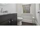 Modern bathroom with marble vanity and dark wood cabinets at 333 Brownstones Ne Cir, Atlanta, GA 30312