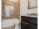 Clean bathroom with tub, shower, and dark vanity at 333 Brownstones Ne Cir, Atlanta, GA 30312