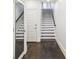 Bright entryway with hardwood floors, stairs, and a full-length mirror at 333 Brownstones Ne Cir, Atlanta, GA 30312