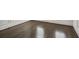 Dark-stained hardwood floors in a corner of a room at 333 Brownstones Ne Cir, Atlanta, GA 30312