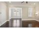 Bright living room with hardwood floors and crown molding at 333 Brownstones Ne Cir, Atlanta, GA 30312