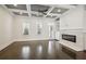 Spacious living room with hardwood floors, fireplace, and coffered ceiling at 333 Brownstones Ne Cir, Atlanta, GA 30312