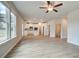 Open living room with kitchen views and ceiling fan at 412 Brekston Way, Mcdonough, GA 30253