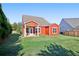 Backyard with grassy lawn and a covered back porch at 100 Academy Ln, Canton, GA 30114