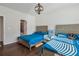 Bedroom with two beds, a relaxing chair, and an ensuite bathroom access at 100 Academy Ln, Canton, GA 30114