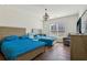 Bedroom furnished with two beds, a gray armchair, and a dresser at 100 Academy Ln, Canton, GA 30114
