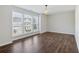 Spacious bedroom with wood-style flooring and large windows offering ample natural light at 100 Academy Ln, Canton, GA 30114