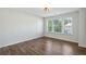 Empty bedroom with wood-style flooring and several windows at 100 Academy Ln, Canton, GA 30114
