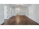 Bonus room or loft area with wood-style flooring, white walls, and access to other rooms at 100 Academy Ln, Canton, GA 30114