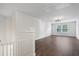 Spacious bonus room with wood-style flooring and large window at 100 Academy Ln, Canton, GA 30114