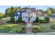 Neighborhood clubhouse with landscaped gardens, sidewalks, and a US flag at 100 Academy Ln, Canton, GA 30114