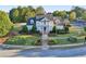 Community clubhouse with landscaped grounds, sidewalks, and parking at 100 Academy Ln, Canton, GA 30114
