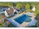 Community pool with a covered area, a water feature, and trees surrounding it at 100 Academy Ln, Canton, GA 30114