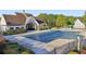 Community pool with a pool house, covered area, and a water feature at 100 Academy Ln, Canton, GA 30114