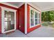 Open front porch with white railing and door with decorative wreath at 100 Academy Ln, Canton, GA 30114